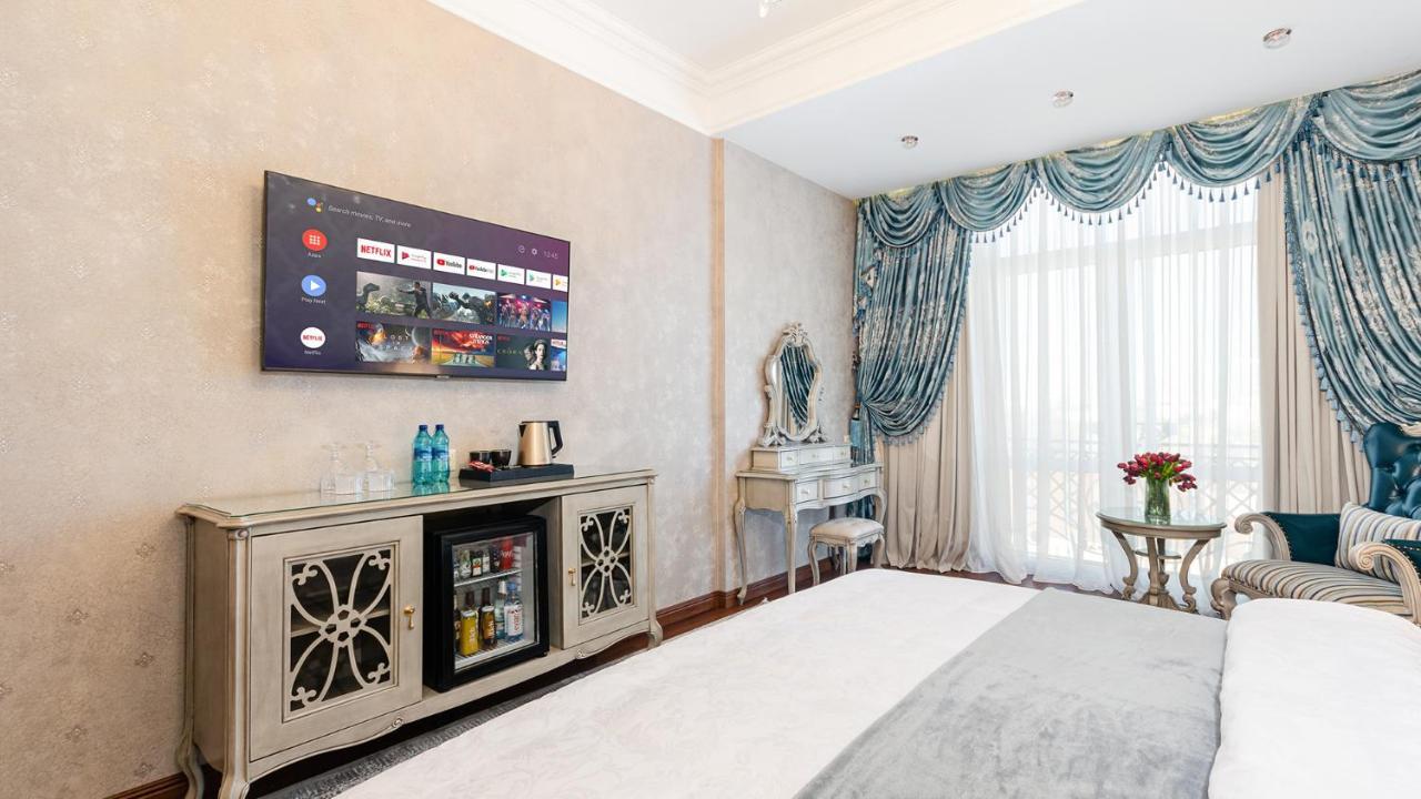 Gregory Boutique Hotel Chisinau Bagian luar foto A 4K UHD TV