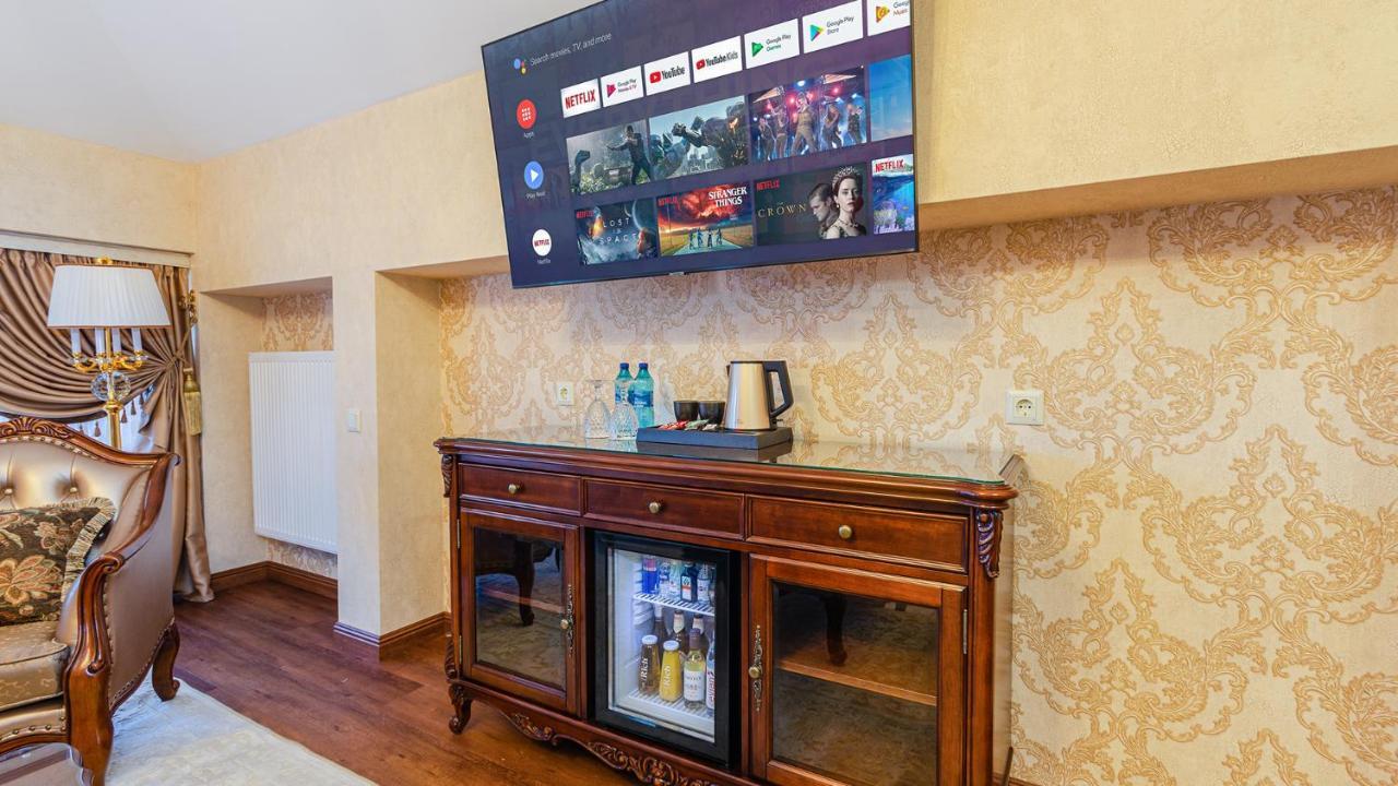 Gregory Boutique Hotel Chisinau Bagian luar foto A television mounted on a wall